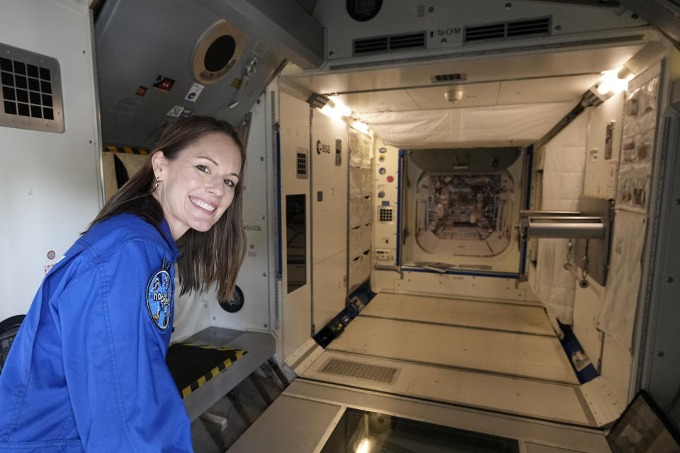 Astronaut Katherine Bennell-Pegg of Australia shows the Columbus training module after the candidates of the Class of 2022 graduation ceremony at the European Astronaut Centre in Cologne, Germany, Monday, April 22, 2024. ESA astronaut candidates Sophie Adenot of France, Pablo Alvarez Fernandez of Spain, Rosemary Coogan of Britain, Raphael Liegeois of Belgium and Marco Sieber of Switzerland took up duty at the European Astronaut Centre one year ago to be trained to the highest level of standards as specified by the International Space Station partners. Also concluding a year of astronaut basic training is Australian astronaut candidate Katherine Bennell-Pegg, who has trained alongside ESA's candidates. (AP Photo/Martin Meissner)