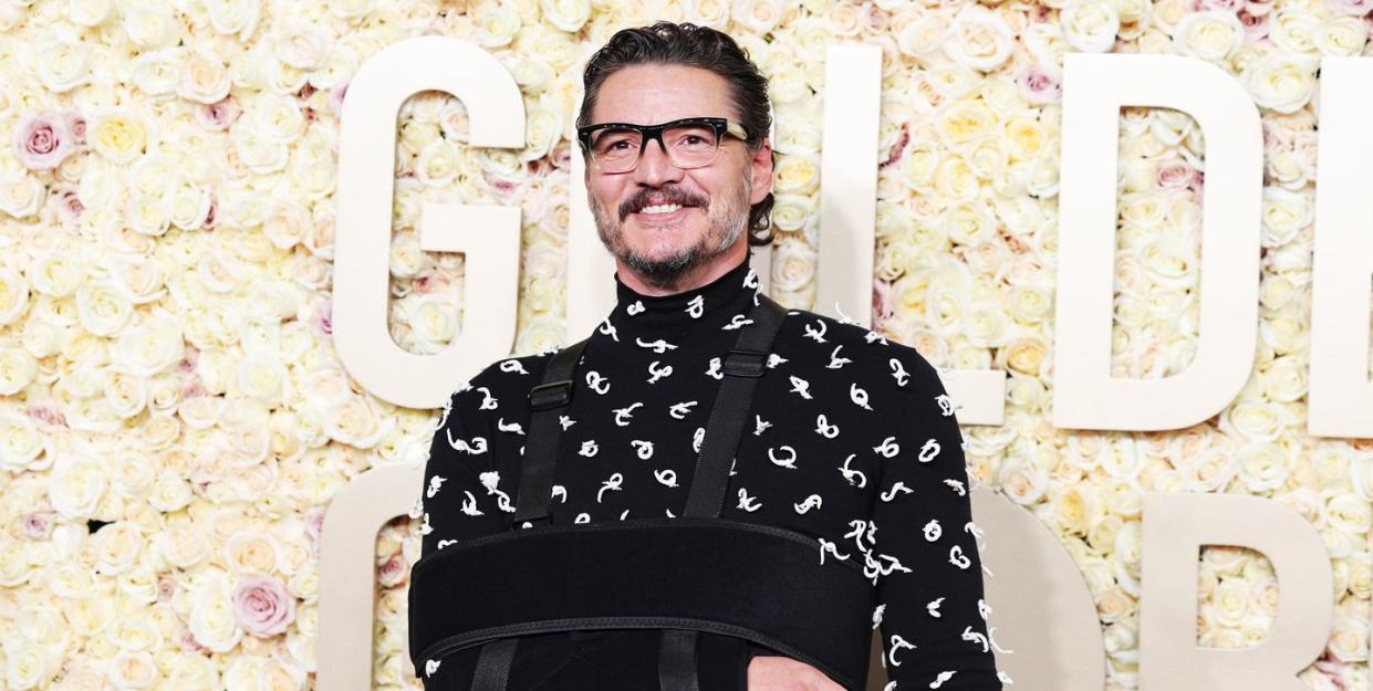 pedro pascal wears an arm sling on the golden globes red carpet