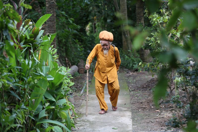 A 92-year-old man shows his five-meter long hair in Vietnam