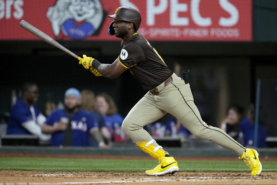 San Diego Padres' Jurickson Profar follows through on a single against the Texas Rangers in the fifth inning of a baseball game Wednesday, July 3, 2024 in Arlington, Texas. (AP Photo/Tony Gutierrez)