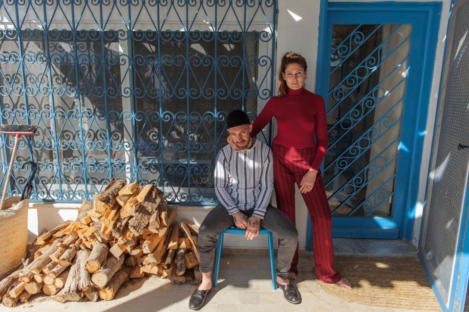 Fergie Chambers and his wife pose for pictures at home in Tunis in Tunisia, on February 8, 2024.