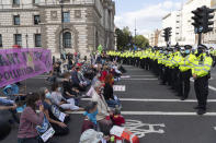 LONDON, UNITED KINGDOM - SEPTEMBER 01: Police officers form a cordon as Extinction Rebellion protesters take part in a demonstration in Parliament Square in London, United Kingdom on September 01, 2020. The group are calling for MPs to support The Climate and Ecological Emergency Bill (CEE Bill). (Photo by Stringer/Anadolu Agency via Getty Images)