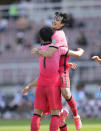 South Korea's Song Min-kyu celebrates with Son Heung-min (7) after scoring his side's first goal against Lebanon during their Asian zone Group H qualifying soccer match for the FIFA World Cup Qatar 2022 at Goyang stadium in Goyang, South Korea, Sunday, June 13, 2021. (AP Photo/Lee Jin-man)