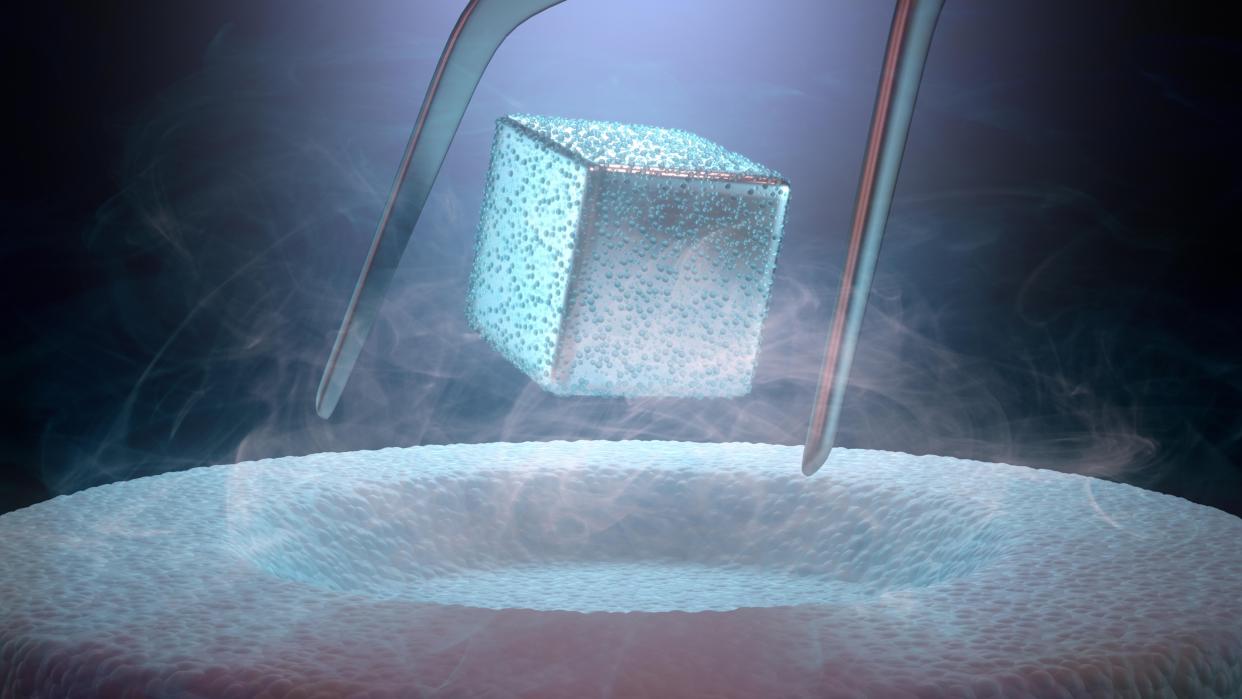  Currently, extreme cold is required to achieve superconductivity, as shown in this artist's concept of a magnet floating above a superconductor cooled with liquid nitrogen. 