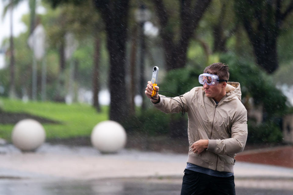 <p>Jacob Woods, a meteorology student at Mississippi State University, measures wind gusts as <a href="https://people.com/human-interest/hurricane-ian-rapidly-strengthening-expected-hit-florida-midweek/" rel="nofollow noopener" target="_blank" data-ylk="slk:Hurricane Ian approaches Sarasota" class="link ">Hurricane Ian approaches Sarasota</a> on Sept. 28.</p>