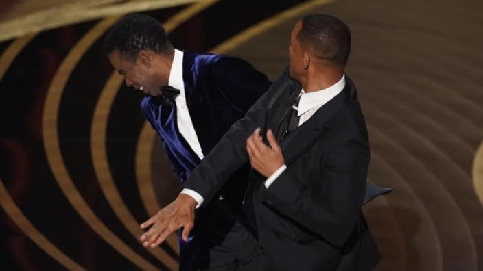 Will Smith (right) slaps presenter Chris Rock on stage while presenting the Academy Award for Best Documentary Feature at the Oscars on Sunday, March 27, 2022, at the Dolby Theatre in Los Angeles. (Photo: Chris Pizzello/AP)