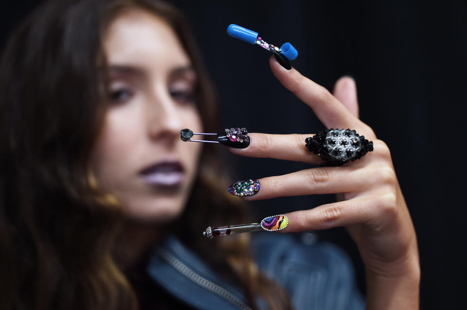 <p>CND co-founder and creative director Jan Arnold and CND creative lead Heather Reynosa, “created 3-D nail designs that were both sculptural and functional full of skulls and safety pins, punk appliques, and wild spirals.” (Photo: CND) </p>