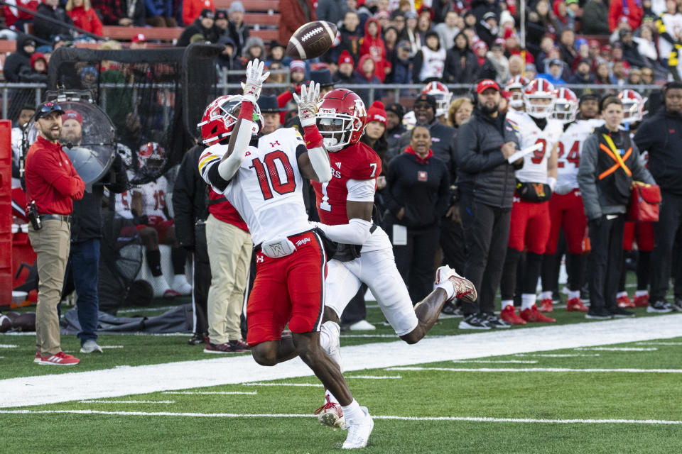 Maryland wide receiver Tai Felton (10) catches a pass in front of Rutgers defensive back Robert Longerbeam (7) and runs in for a touchdown in the first half of an NCAA college football game, Saturday, Nov. 25, 2023, in Piscataway, N.J. (AP Photo/Corey Sipkin)