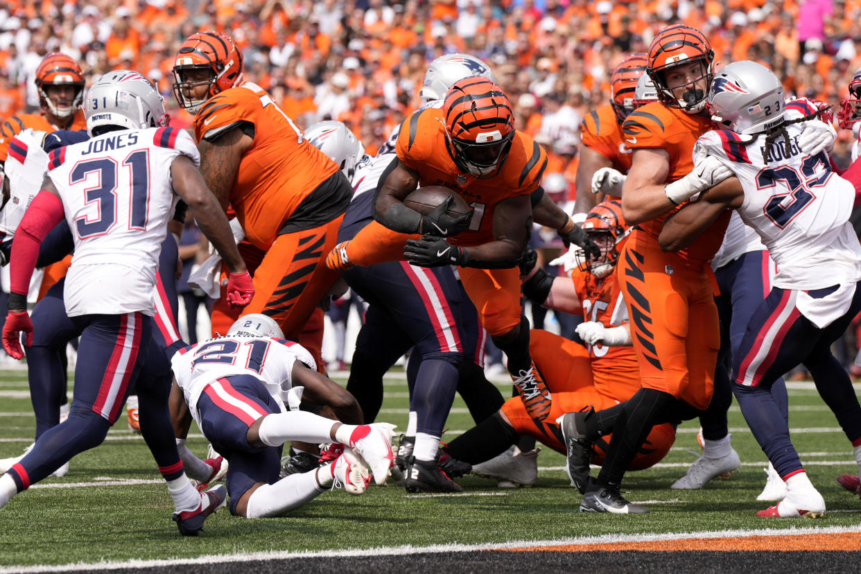 Cincinnati Bengals running back Zack Moss (31) scores on a 5-yard touchdown run during the second half of an NFL football game against the New England Patriots, Sunday, Sept. 8, 2024, in Cincinnati. (AP Photo/Jeff Dean)