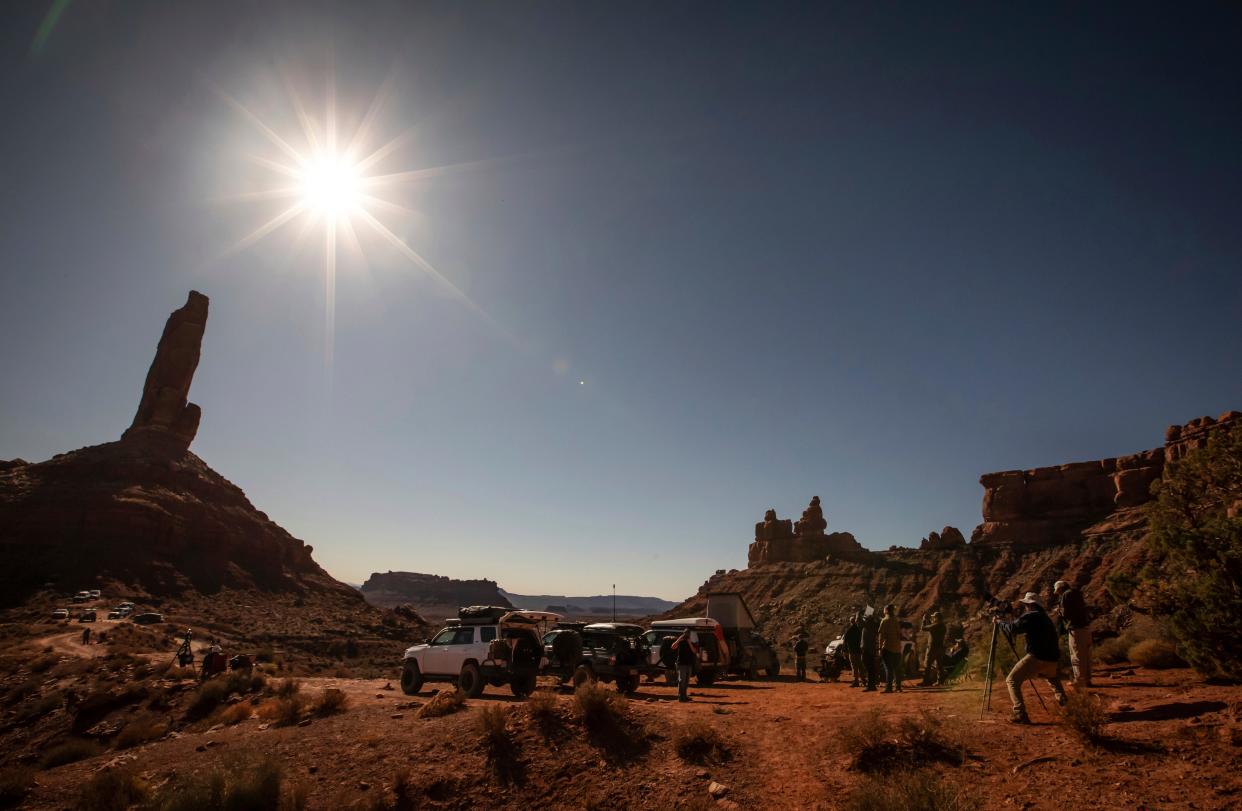 Visitors gather to photograph the annular solar eclipse in the Valley of the Gods outside Bears Ears National Monument in Utah, on Saturday, Oct. 14, 2023. The eclipse was visible throughout most of the western United States.