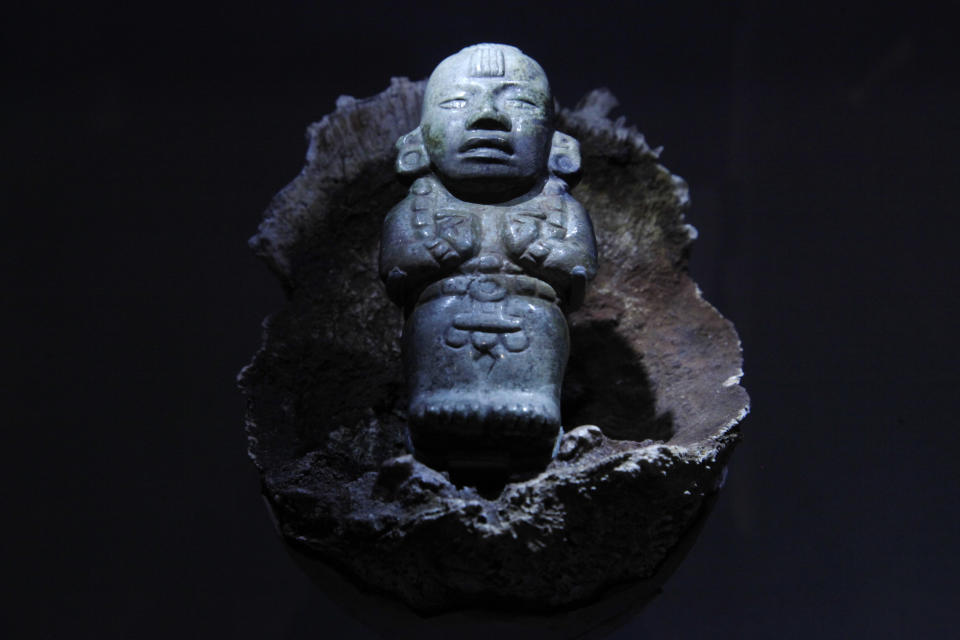 A jade figurine of Maize God is shown at the Maya 2012: Lords of Time exhibit at the University of Pennsylvania Museum of Archaeology and Anthropology Thursday, May 3, 2012, in Philadelphia. The exhibit is scheduled to open May 5. (AP Photo/Matt Rourke)