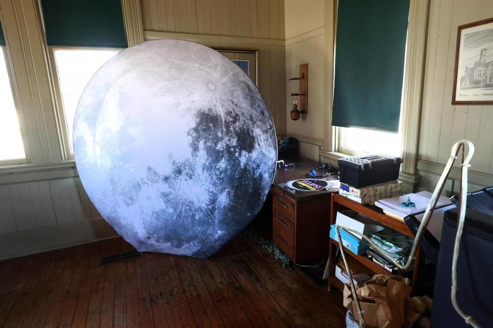 A large moon photo backdrop sits in the office of the Hillsboro Chamber of Commerce among other eclipse branded items on Thursday, February 22, 2024. Hillsboro has spent the last year-and-a-half laying plans for the total solar eclipse happening on April 8.