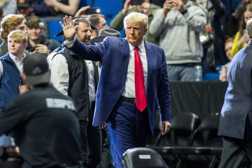 Mar 18, 2023; Tulsa, OK, USA; Former President Donald Trump waves to the crowd March 18 before the NCAA D1 Wrestling Championships in Oklahoma. (Brett Rojo-USA TODAY Sports) Brett Rojo/USA TODAY NETWORK