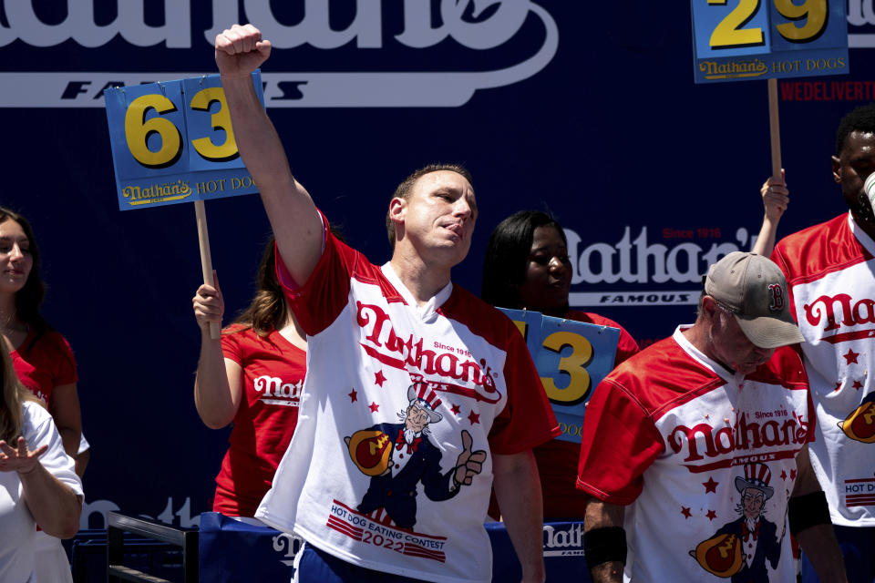 Joey Chestnut reacts after winning the Nathan's Famous Fourth of July hot dog eating contest in Coney Island on Monday, July 4, 2022, in New York. Chestnut at 63 hotdogs to win the men's division of the contest. (AP Photo/Julia Nikhinson)