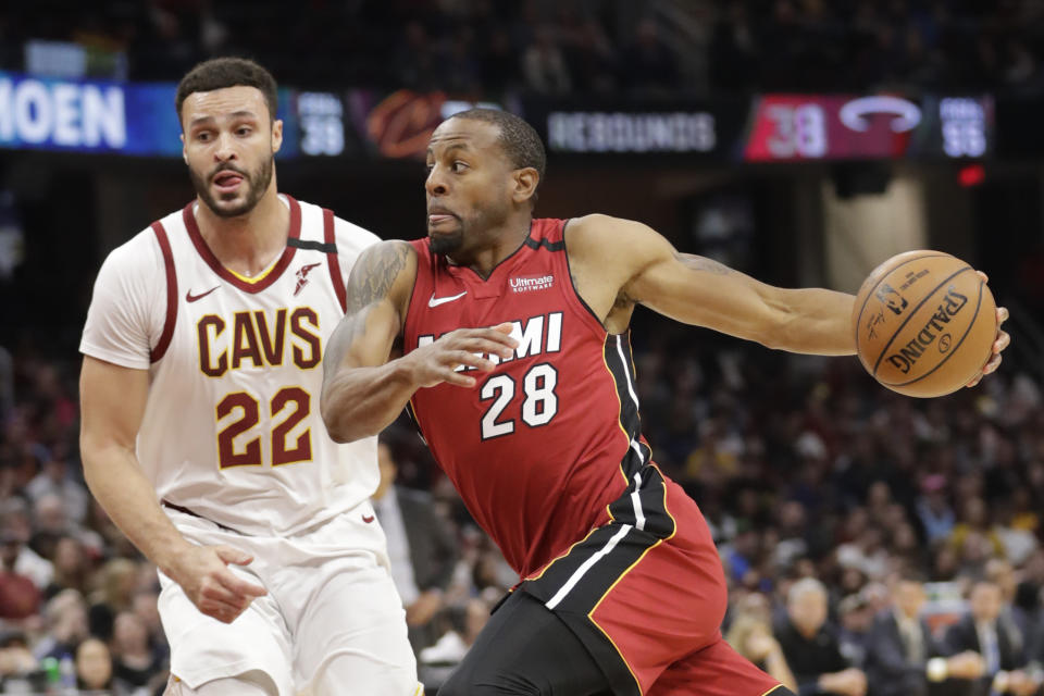 Miami Heat's Andre Iguodala (28) drives past Cleveland Cavaliers' Larry Nance Jr. (22) in the second half of an NBA basketball game, Monday, Feb. 24, 2020, in Cleveland. (AP Photo/Tony Dejak)