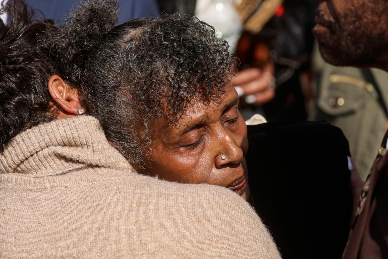 Two women hug at a press conference after the Buffalo, N.Y., mass shooting.