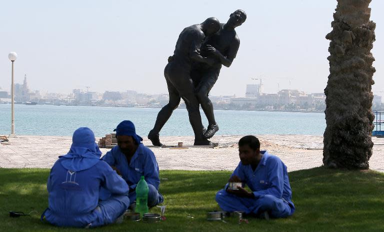 The statue of Zinedine Zidane headbutting Marco Materazzi, on the corniche in Qatar on October 4, 2013