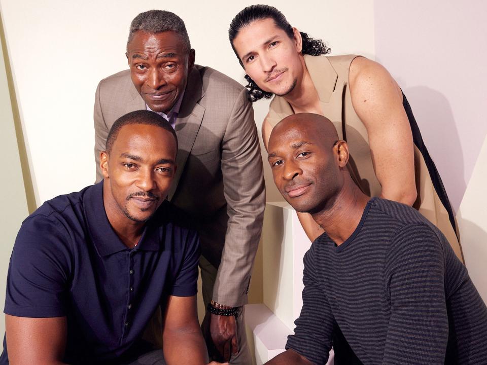 ANAHEIM, CALIFORNIA - SEPTEMBER 10: (L-R) Anthony Mackie, Carl Lumbly, Danny Ramirez, and Julius Onah pose at the IMDb Official Portrait Studio during D23 2022 at Anaheim Convention Center on September 10, 2022 in Anaheim, California.