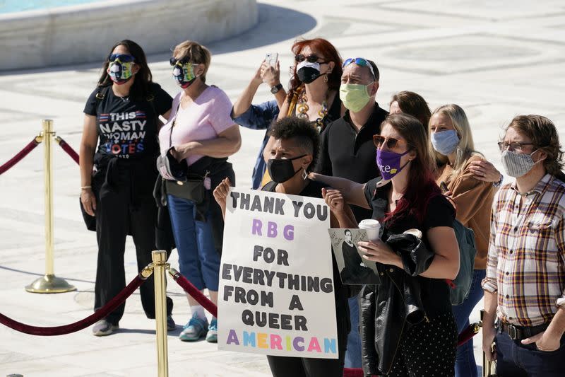 People pay respects as Justice Ruth Bader Ginsburg lies in repose under the Portico at the top of the front steps of the U.S. Supreme Court building