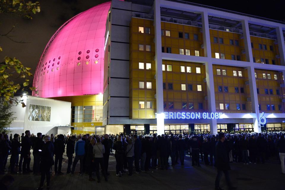 FILE - In this photo taken Monday, Sept. 21, 2015, people queue outside the Globe Arena for a U2 concert in Stockholm, Sweden on Sept. 21, 2015. The indoor arena in Stockholm, which first opened in 1989, is being renamed AVICII ARENA, named after DJ Avicii, born Tim Bergling, who died by suicide at age 28 in 2018. (Pontus Lundahl/TT News Agency via AP) SWEDEN OUT