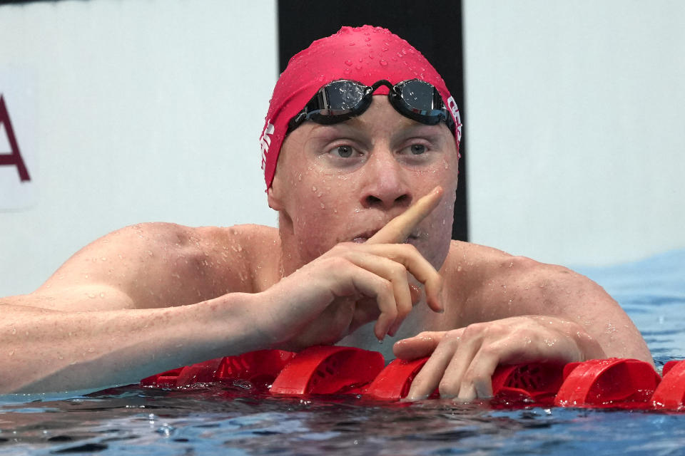 Tom Dean of Britain celebrates after winning the final of the men's 200-meter freestyle at the 2020 Summer Olympics, Tuesday, July 27, 2021, in Tokyo, Japan. (AP Photo/Matthias Schrader)