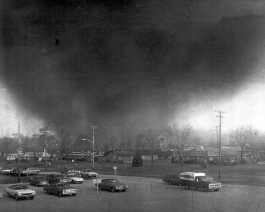 FILE – A tornado funnel moves through the southeast Pine Crest Garden section of Xenia, Ohio, Wednesday was April 3, 1974. The deadly tornado killed 32 people, injured hundreds and leveled half the city of 25,000. Nearby Wilberforce was also hit hard. As the Watergate scandal unfolded in Washington, President Richard Nixon made an unannounced visit to Xenia to tour the damage. Xenia’s was the deadliest and most powerful tornado of the 1974 Super Outbreak. (AP Photo/Fred Stewart, file)