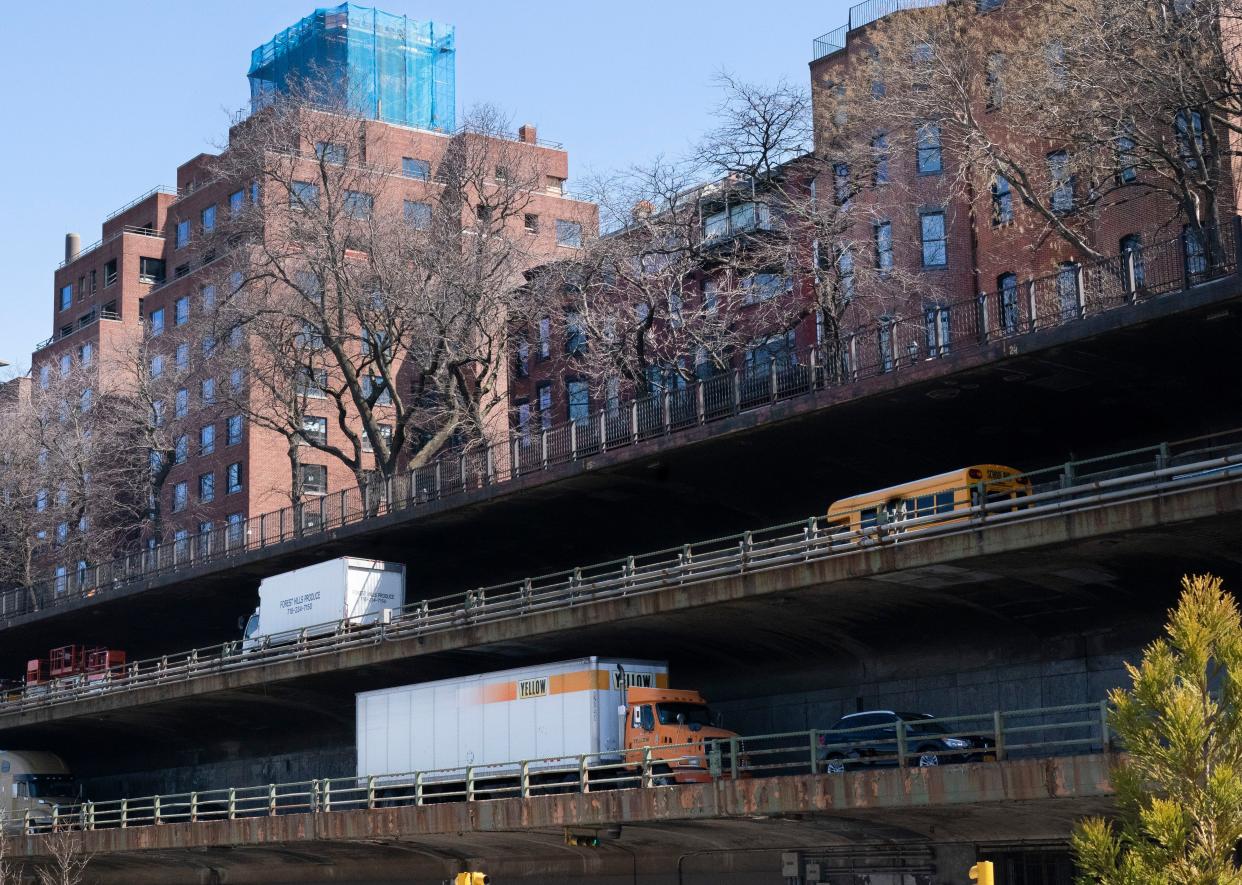 Vehicles drive along the Brooklyn Queens Expressway, part of the city's aging infrastructure, beneath the Brooklyn Heights promenade, Tuesday, April 6, in New York. 