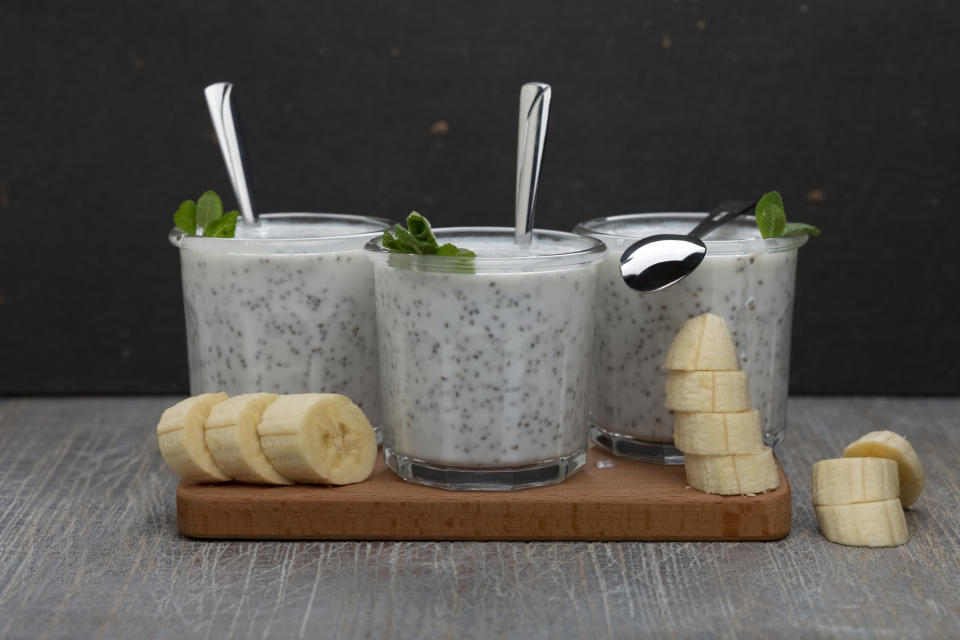 Three chia seed smoothies with bananas on the side