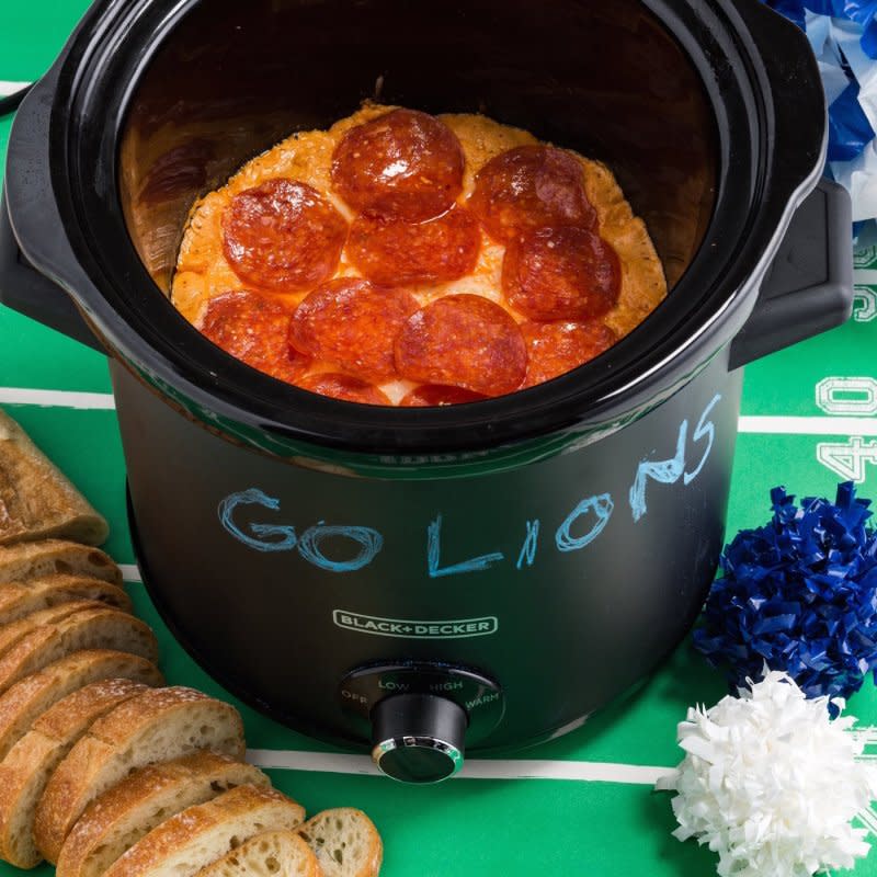 <p>Mark Boughton Photography / styling by Teresa Blackburn</p><p>Although Slow-Cooker Pizza Dip makes a great game-day dip, it’s also perfect for Sunday movie nights with the <a href="/1045384/marynliles/family-quotes/" data-ylk="slk:family;elm:context_link;itc:0;sec:content-canvas" class="link rapid-noclick-resp">family</a>. </p><p><strong>Get the recipe: <a href="https://parade.com/841890/alison-ashton/slow-cooker-pizza-dip/" rel="nofollow noopener" target="_blank" data-ylk="slk:Slow-Cooker Pizza Dip;elm:context_link;itc:0;sec:content-canvas" class="link rapid-noclick-resp">Slow-Cooker Pizza Dip</a></strong></p>