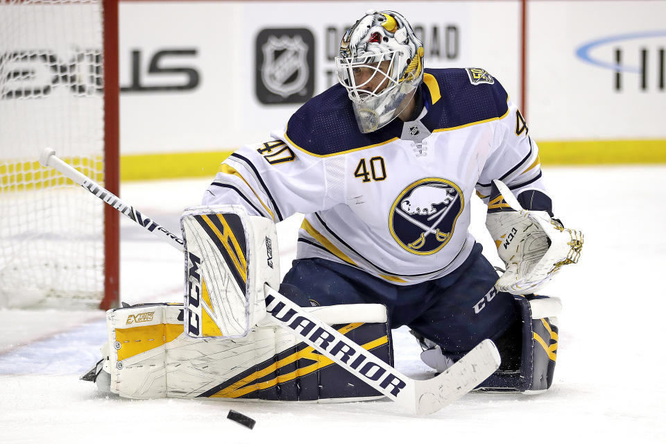 Buffalo Sabres goaltender Carter Hutton blocks a shot during the second period of the team's NHL hockey game against the Pittsburgh Penguins in Pittsburgh, Saturday, Feb. 22, 2020. (AP Photo/Gene J. Puskar)