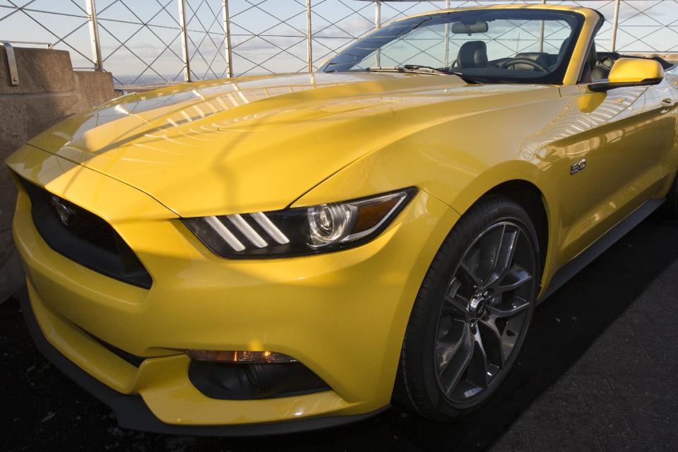 Ford Motor Company introduces the all-new 2015 Mustang convertible on the 86th floor observation deck of the Empire State Building during the New York International Auto Show, Wednesday, April 16, 2014, in New York. (AP Photo/John Minchillo)