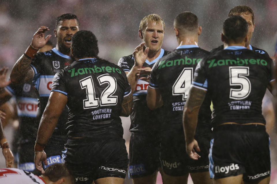 Sharks players, pictured here celebrating after a try against the Dragons.