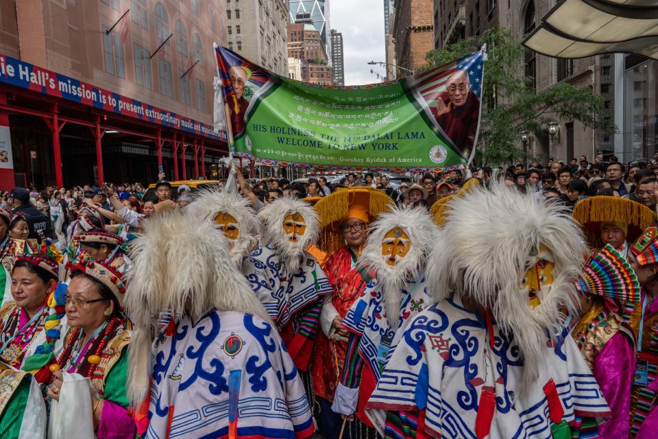 People await the arrival of Tibetan spiritual leader the Dalai Lama at his hotel in New York on June 23, 2024, as he prepares to undergo knee surgery. (Photo by Adam GRAY / AFP) (Photo by ADAM GRAY/AFP via Getty Images)