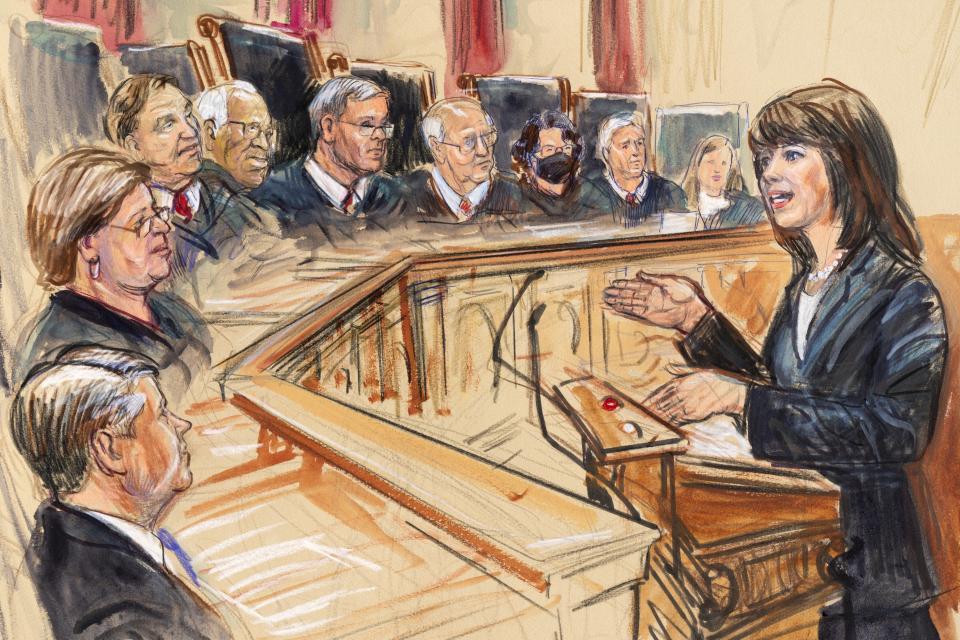 This artist sketch depicts Solicitor General Elizabeth Prelogar, right, presenting an argument before the Supreme Court, Monday, Nov. 1, 2021, in Washington. Justices seated from left are Associate Justice Brett Kavanaugh, Associate Justice Elena Kagan, Associate Justice Samuel Alito, Associate Justice Clarence Thomas, Chief Justice John Roberts, Associate Justice Stephen Breyer, Associate Justice Sonia Sotomayor, Associated Justice Neil Gorsuch and Associate Justice Amy Coney Barrett. (Dana Verkouteren via AP)