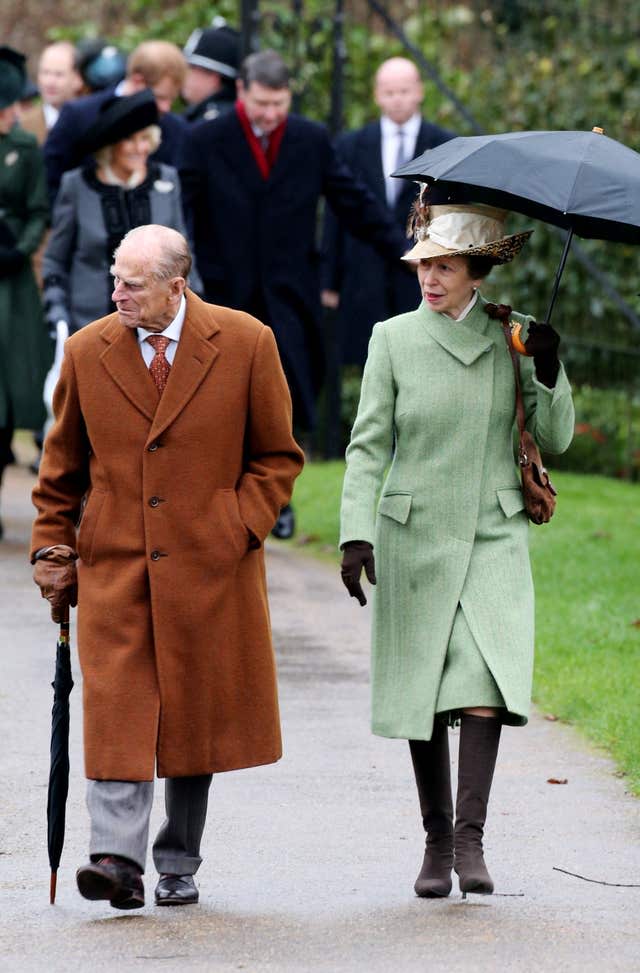 Philip and the Princess Royal leave the morning Christmas Day service at St Mary Magdalene Church on the Sandringham estate