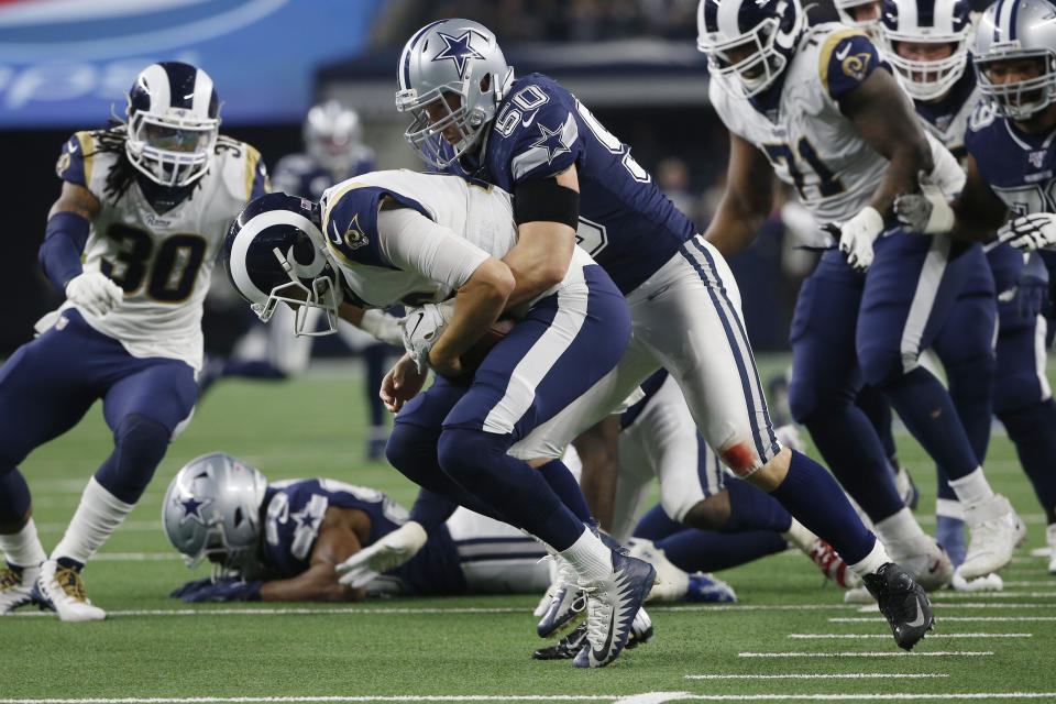 Dallas Cowboys outside linebacker Sean Lee (50) tackles Los Angeles Rams quarterback Jared Goff (16) in the second half of an NFL football game in Arlington, Texas, Sunday, Dec. 15, 2019. (AP Photo/Ron Jenkins)