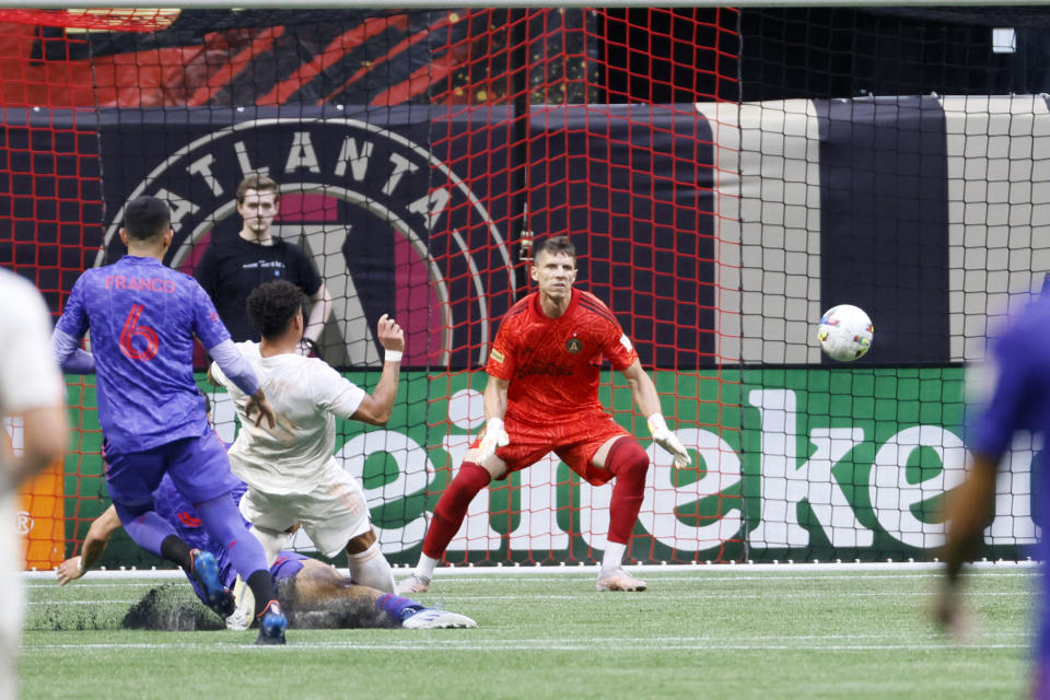 Columbus Crew attacker Erick Hurtado, second from left, connects with the ball for the team's second goal against Atlanta United, during the first half of an MLS soccer match in Atlanta, Saturday, May 28, 2022. (Miguel Martinez/Atlanta Journal-Constitution via AP)