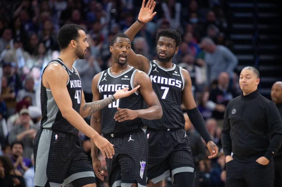 The Sacramento Kings’ Trey Lyles (41), Harrison Barnes (40) and Chimezie Metu (7) celebrate a lead against the Los Angeles Clippers at Golden 1 Center in March.