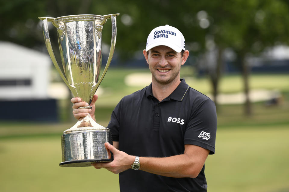 FILE - Patrick Cantlay holds the FedEx cup trophy after winning the BMW Championship golf tournament at Wilmington Country Club, Sunday, Aug. 21, 2022, in Wilmington, Del. Cantlay is expected to compete in the PGA Championship next week at Oak Hill Country Club in Pittsford, N.Y.(AP Photo/Nick Wass, File)