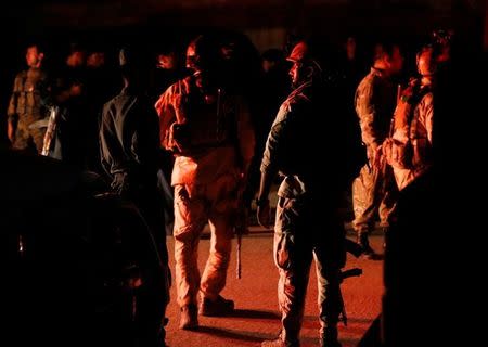 Afghan security forces arrive at the site of an attack at American University of Afghanistan in Kabul, Afghanistan August 24, 2016. REUTERS/Omar Sobhani