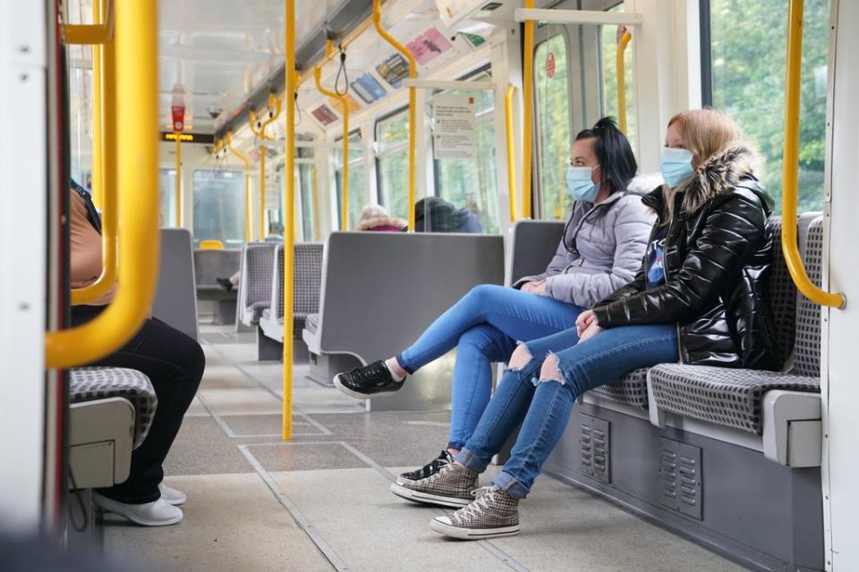 Passengers wearing face masks on a train in Newcastle as face coverings once again become mandatory on public transport in England (Owen Humphreys/PA) (PA Archive)