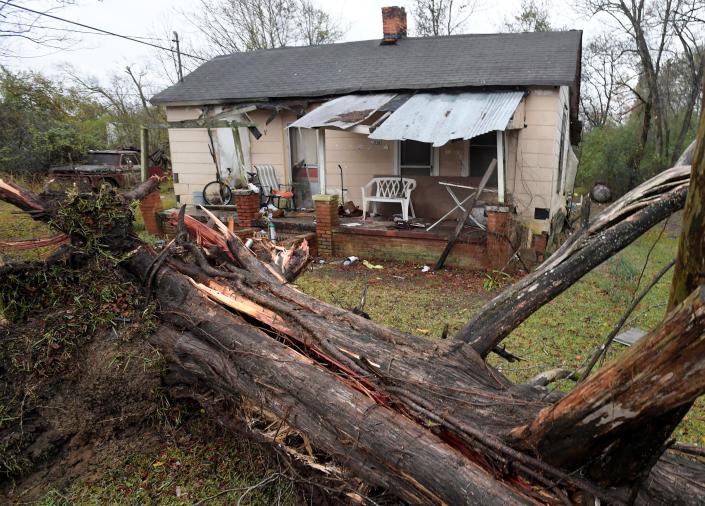 A large tree is seen down near a house on Lower Wetumpka Road near the scene of overnight fatal storms in Montgomery, Ala., on Wednesday morning November 30, 2022. 