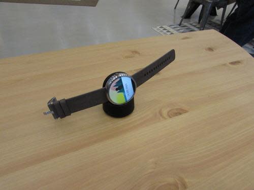 Motorola Moto 360 smartwatch on charger