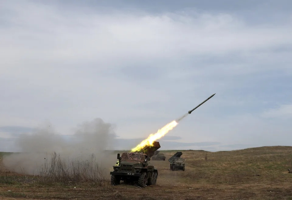 A Ukrainian multiple rocket launcher BM-21 "Grad" shells Russian troops' position, near Lugansk, in the Donbas region, on April 10, 2022.