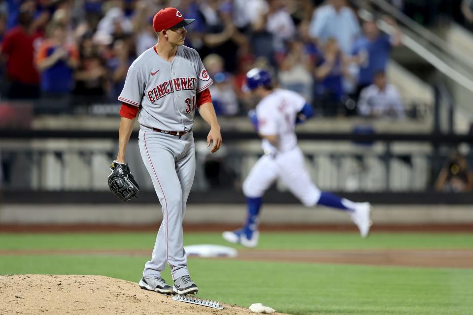 Aug 9, 2022; New York City, New York, USA; Cincinnati Reds starting pitcher Mike Minor (31) reacts after allowing a solo home run to New York Mets left fielder Jeff McNeil (1) during the fourth inning at Citi Field. Mandatory Credit: Brad Penner-USA TODAY Sports