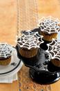 <p>Super-easy white-chocolate toppers appear to float, Houdini-like, over chocolate cupcakes.</p><p><strong><a href="https://www.countryliving.com/food-drinks/recipes/a3015/itsy-bitsy-spiderwebs-cupcakes-recipe/" rel="nofollow noopener" target="_blank" data-ylk="slk:Get the recipe for Itsy Bitsy Spiderwebs Cupcakes" class="link ">Get the recipe for Itsy Bitsy Spiderwebs Cupcakes</a>.</strong></p>