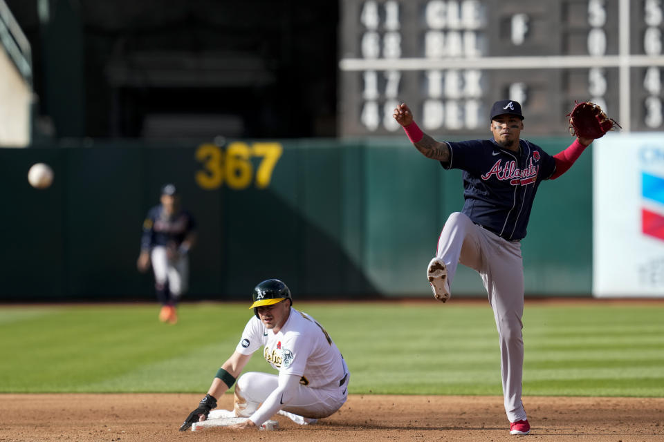 Atlanta Braves shortstop Orlando Arcia, right, turns a double play after forcing out Oakland Athletics' Ryan Noda, left, at second base during the third inning of a baseball game in Oakland, Calif., Monday, May 29, 2023. (AP Photo/Godofredo A. Vásquez)