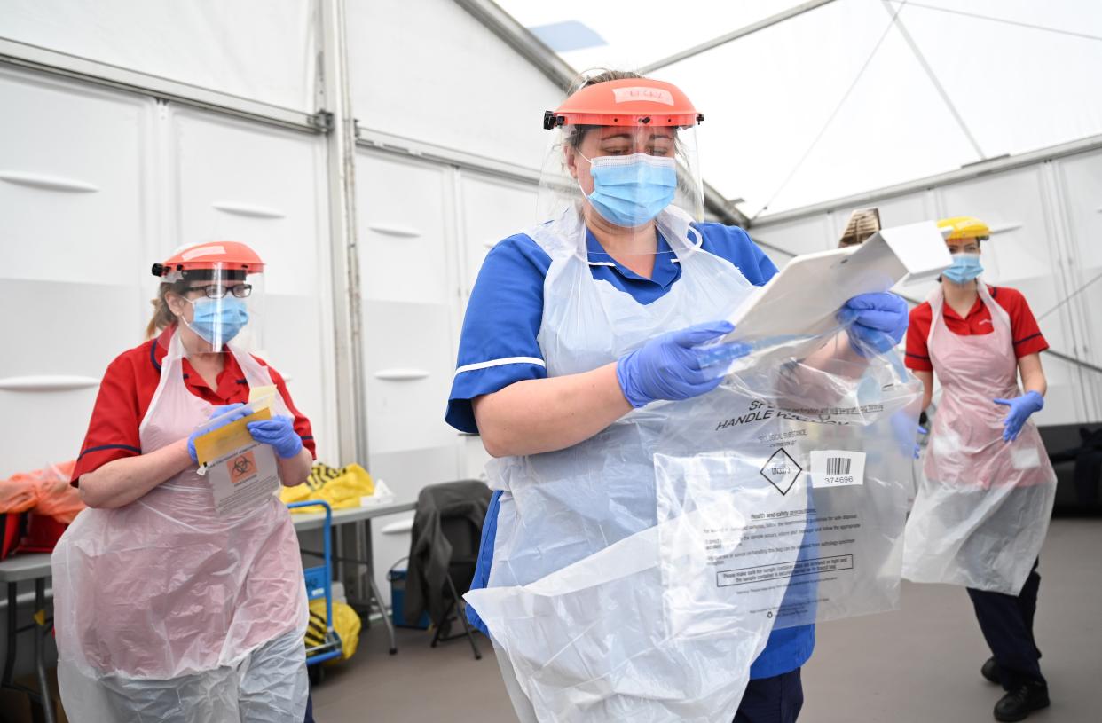 <p>NHS staff have had to face many obstacles over the last 12 months</p> (POOL/AFP via Getty Images)