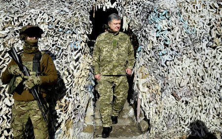 FILE PHOTO: Ukraine's President Petro Poroshenko attends a meeting with servicemen of the special forces unit "Azov", part of the Ukrainian National Guard, during a visit to Donetsk Region, Ukraine March 14, 2019. Mykola Lazarenko/Ukrainian Presidential Press Service/Handout via REUTERS/File Photo ATTENTION EDITORS - THIS IMAGE WAS PROVIDED BY A THIRD PARTY.