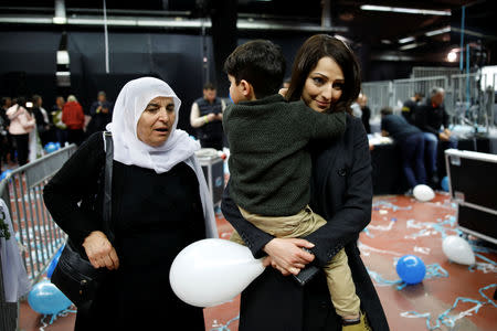 Gadeer Mreeh, a Druze women running on a ticket alongside former armed forces chief Benny Gantz, leaves with her family members after attending a party event in Tel Aviv, Israel February 19, 2019. Picture taken February 19, 2019. REUTERS/Amir Cohen